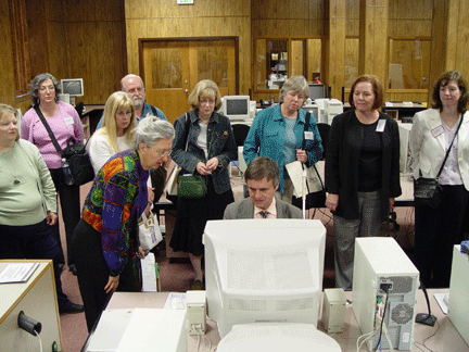 Another tour group watches Steve Booth at a computer in the International Braille and Technology Center for the Blind.
