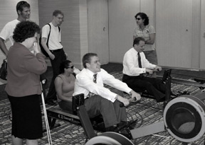Pat Maurer (left) watches while David Maurer and President Maurer engage in a friendly rowing competition.