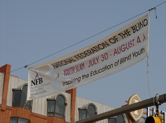 Baltimore residents knew that something special was happening in late July when a giant banner went up at the intersection of Lee and Light Streets, beside the Maryland Science Center. It told everyone who drove past that the National Federation of the Blind was conducting the Youth Slam.