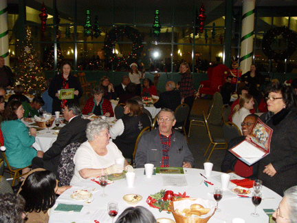 Each December the National Center staff has a holiday party in Members Hall in the Jernigan Institute. Here staff members enjoy dinner at the party. Those who choose to can participate in a staff-wide gift exchange. Throughout December holiday-wrapped packages proliferate under the tree.