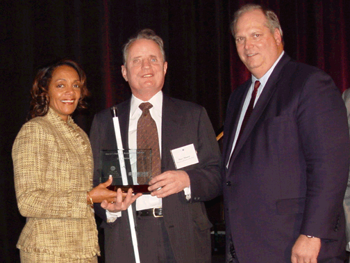 The National Federation of the Blind was honored at Baltimore Mayor Sheila Dixon's first Greater Baltimore Committee (GBC) Business Recognition Luncheon at the Hyatt Regency Baltimore on Friday, December 7, 2007. Pictured here holding the handsome plaque (left to right) are Mayor Dixon, NFB President Marc Maurer, and GBC President and CEO Donald C. Fry.