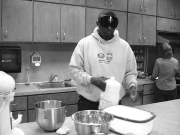 Clarence Davis assembles a carrot cake.