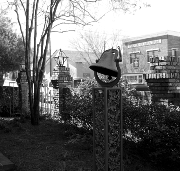 The courtyard in front of the Louisiana Center for the Blind. The freedom bell can be seen in the foreground.