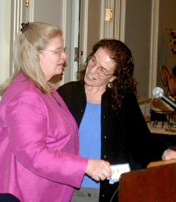 Carol Castellano (right) presents the Dan Ryles Memorial Award to Ruby Ryles.