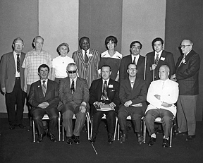 : Perry Sundquist edited the Monitor for a number of years. Pictured here with the 1971 executive committee of the National Federation of the Blind, he is standing at the far left.