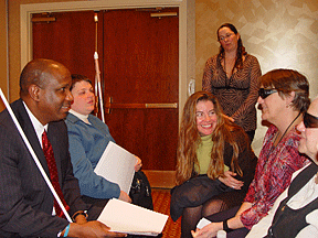 Anil Lewis coaches Blind Industries and Services of Maryland CORE students (Left to Right) Anil Lewis, Jennifer Bopp, Becky Keller (standing), Grainne Nic Daeid, Connie Taylor, and Dana Rau as they practiced arguing the case for our legislative agenda.