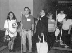 Picture of a line of Music Division members waiting to register.