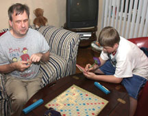 Eric and Lucas Duffy play scrabble