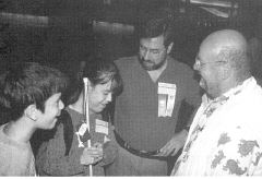 Serena with her brother, father and first mobility instructor.
