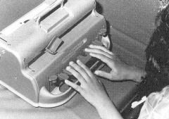 Picture of hands on a Braille Writer keyboard