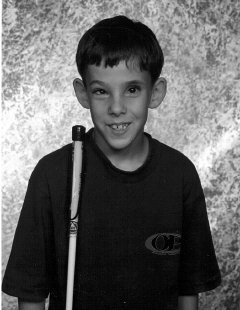 Cody Greises of Montana uses an NFB fiberglass cane of about shoulder height.