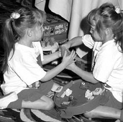 Macy and her twin sister Madison enjoy a game together at NFB camp