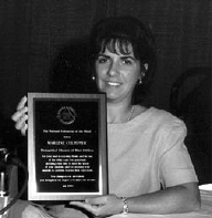 Marlene Culpepper displays her 2000 Distinguished Educator of Blind Children Award plaque