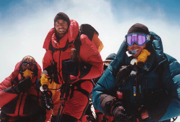 Erik (center) poses with fellow climbers at the summit of the world�s tallest peak in 2001.