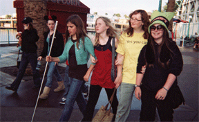 Kyra (age 13) and friends at the California Adventure Park hustle to get to the next ride.