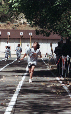 Running in the Braille Institute Olympics. (Kyra, age 7)