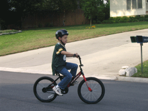 Ryan enjoys a ride on his bike.