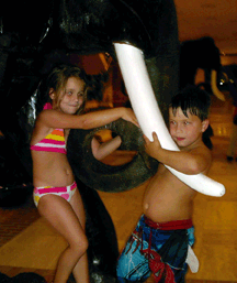 Imilie and Jackson West of Mississippi play on the elephant statuary in the lobby of the Hilton Anatole Hotel in Dallas, Texas.