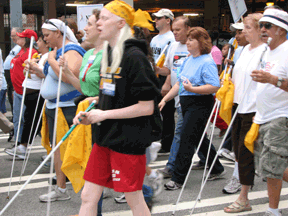 A group marches with their canes.