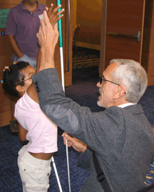 Robert Leslie Newman enjoys helping Victoria Parsons and other blind youth.