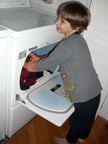There�s no reason blind children can�t help out with the household chores. Here, Petras knows that loading and unloading the dryer helps his parents today, but it also helps him learn independence for life.