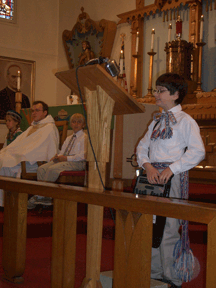Vejas confidently reads from his BrailleNote during a special Lithuanian mass.