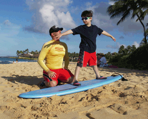 Vejas and his surfing instructor Miguel go over every detail of surfing before heading out to catch the waves. But with the extensive preparation also comes a high degree of expectations, thus achieving �favored instructor� status for Miguel.