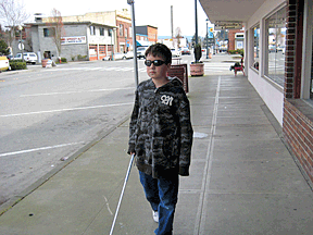 Extensive practice in real-world environments are fundamentally necessary to produce competent and confident travelers. The use of blindfold (or sleepshades) by this fifth-grader leads to significant confidence building.