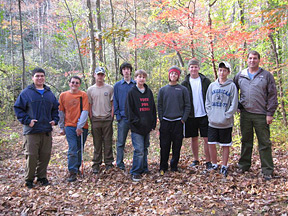 Holding his cane, Eric Marten poses with his Scoutmaster and seven other Scouts.