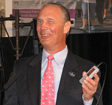 Jim Gashel holding a KNFB Reader