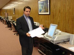 Rob Resuali from AutoMARK Technical Systems, LLC, demonstrates his company's machine