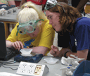 Two girls conducting a science experiment