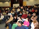 Career Fair attendees listen to presenters during workshops.