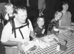 Picture of the Gabias family enjoying Texas barbecue.