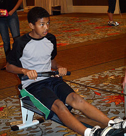 Phil Adams uses rowing machine