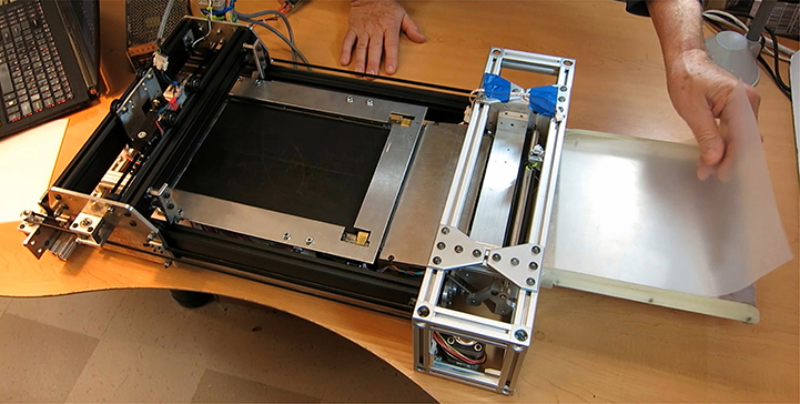 Figure 7. Printer with blank sheet being inserted into Brailler stage